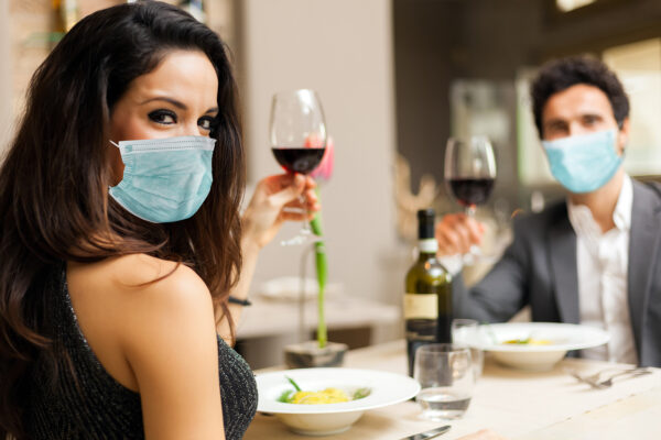 Couple toasting wineglasses in a luxury restaurant